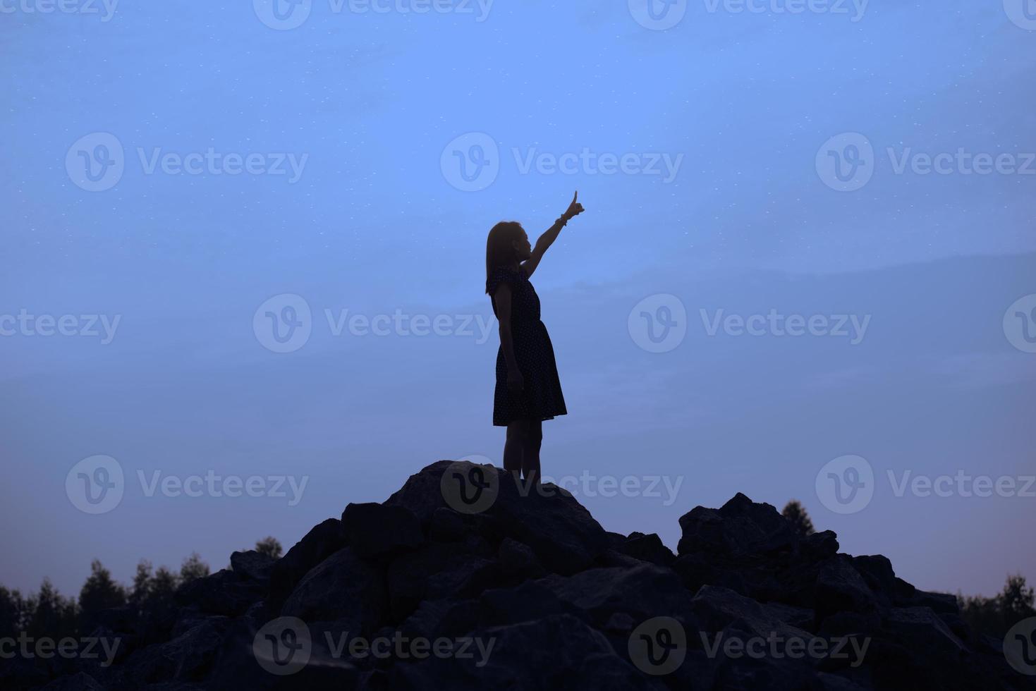 Silhouette sad girl at sunset. photo