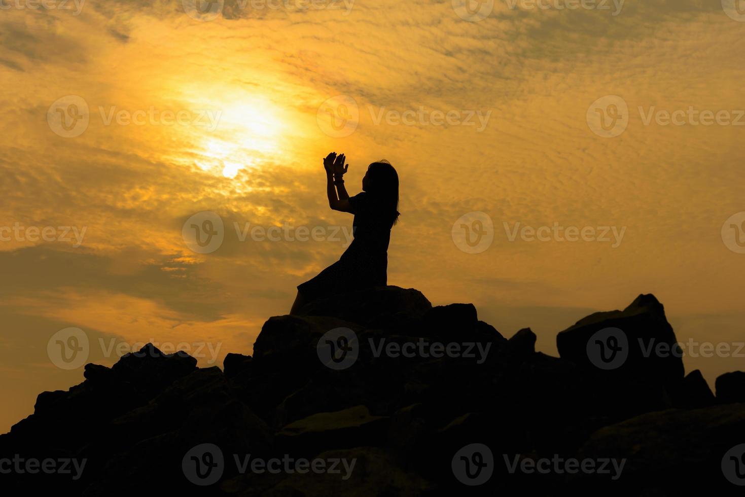 Silhouette sad girl at sunset. photo