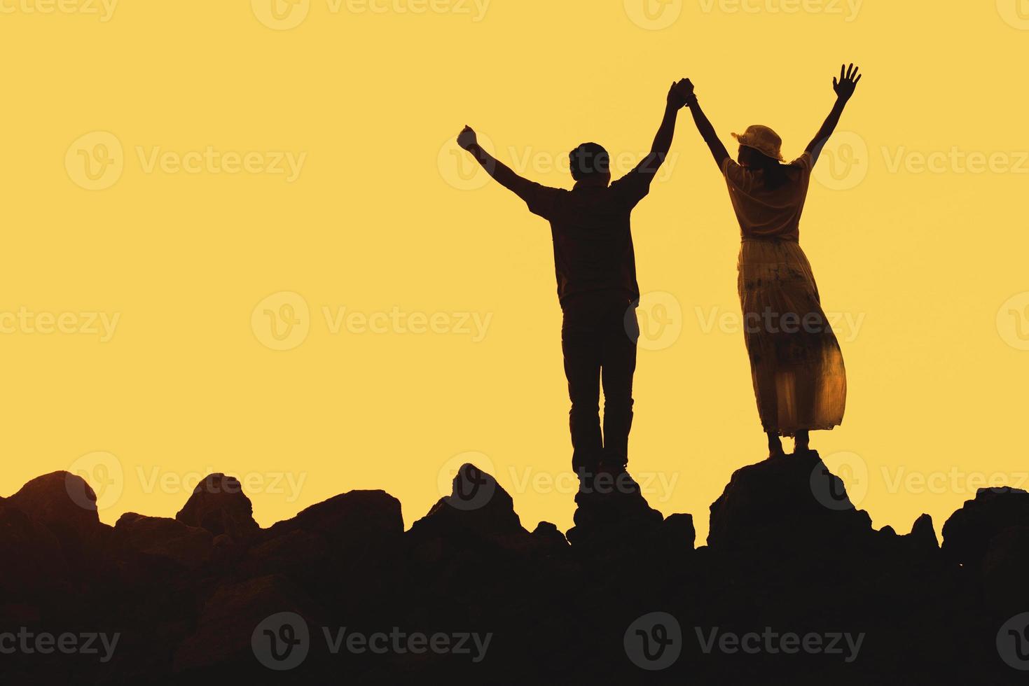 Happy young couple together against beautiful sunset. Freedom, photo