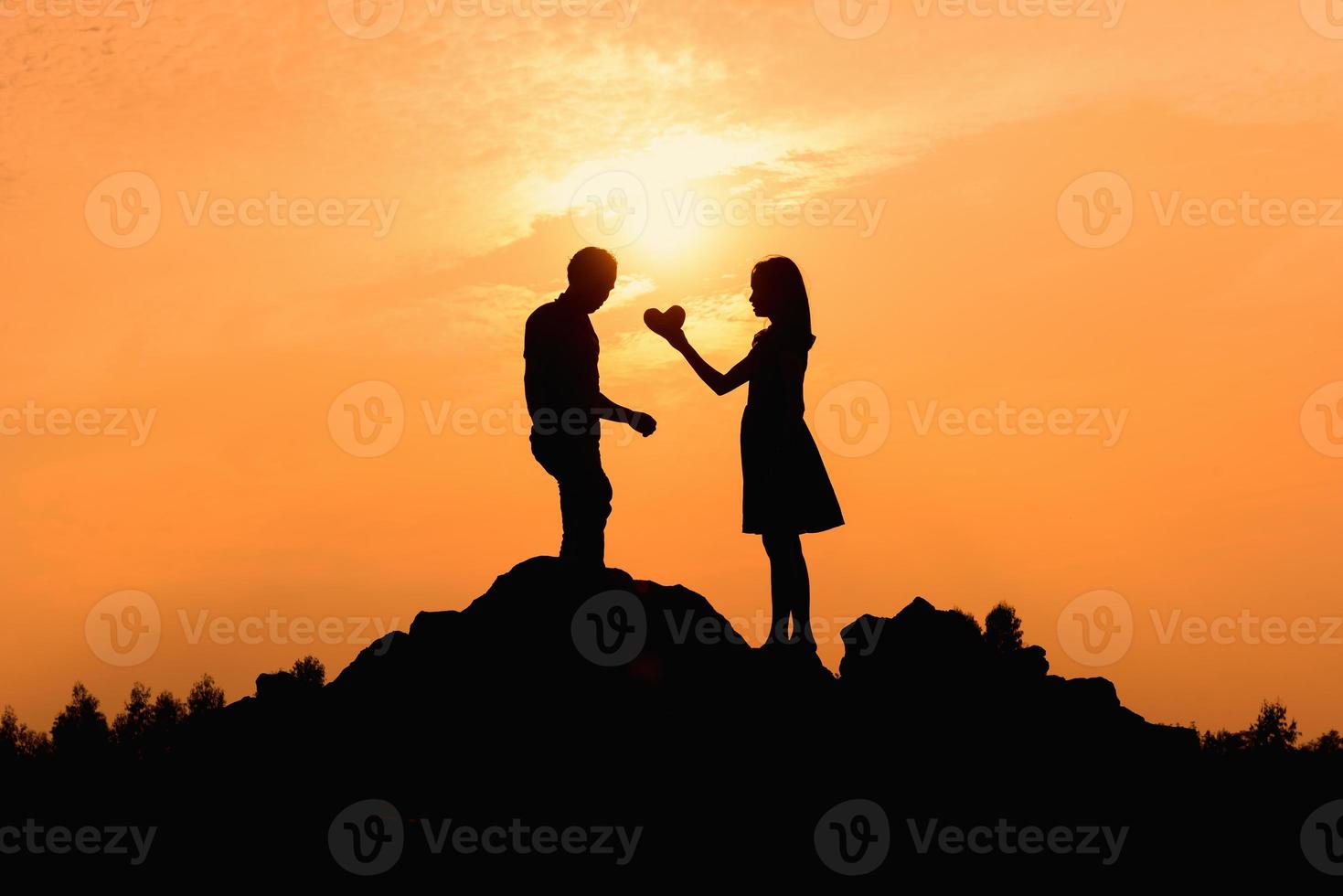 Happy young couple together against beautiful sunset. Freedom, photo