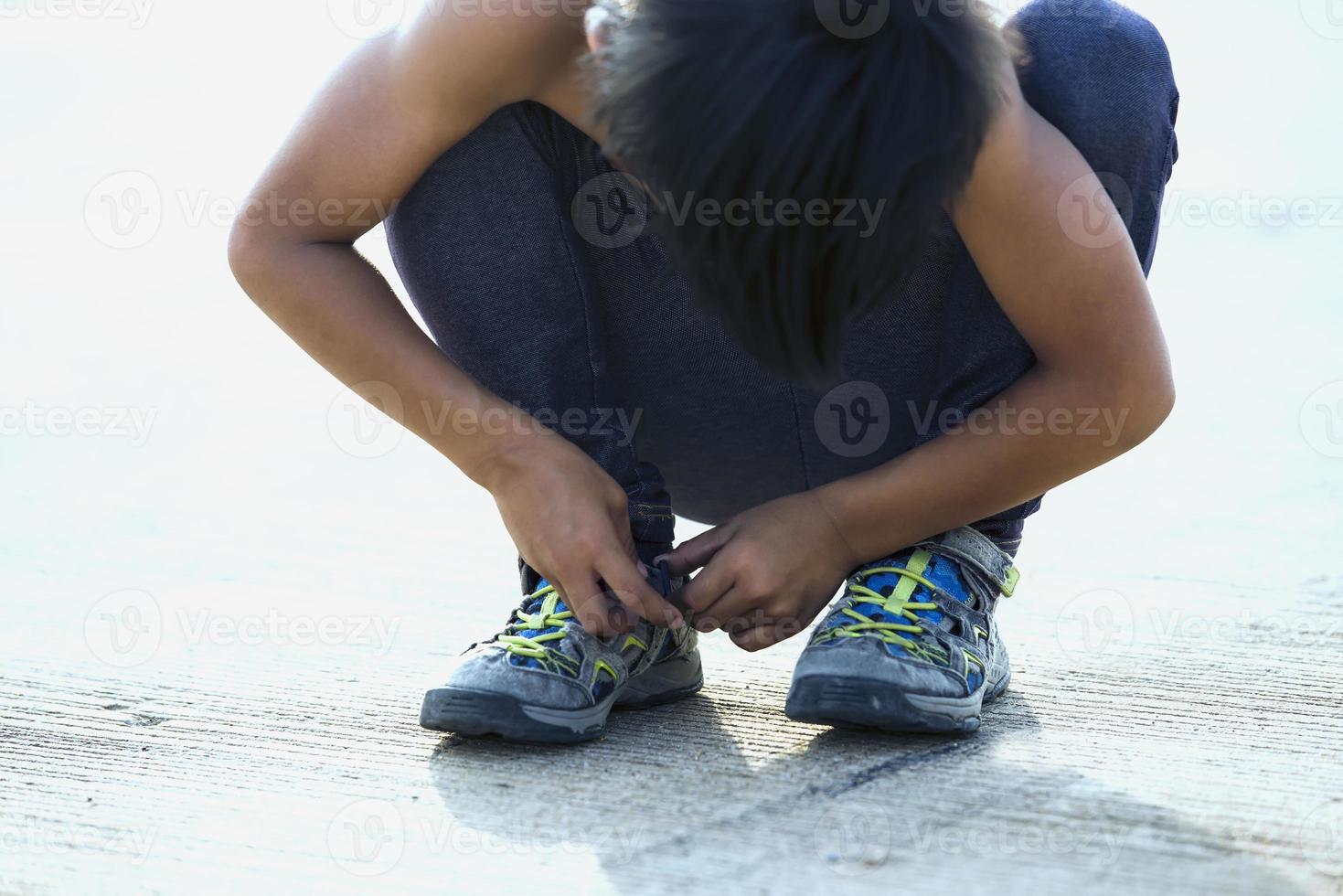 A child Close up of shoes for running on the bridge. photo