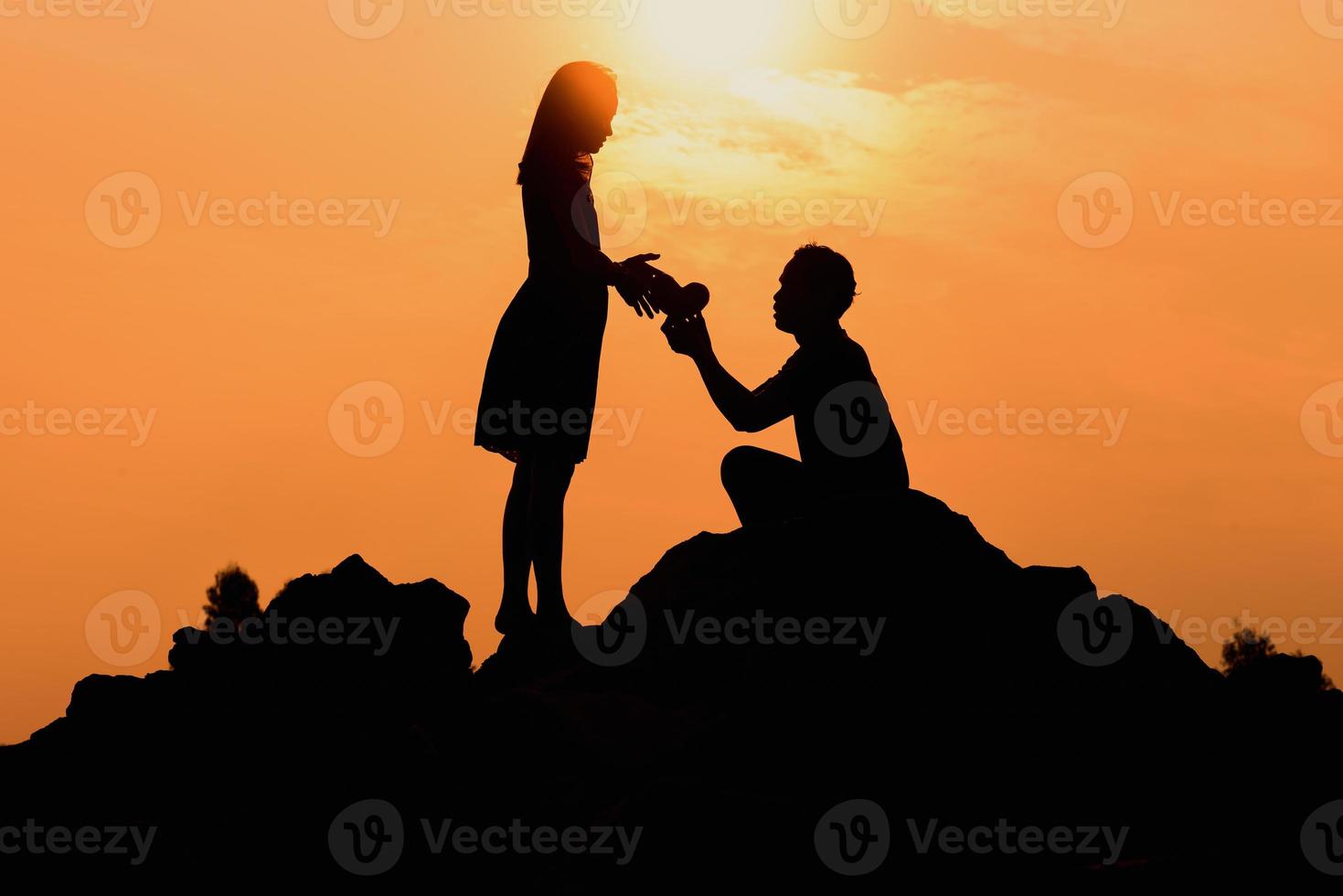 Happy young couple together against beautiful sunset. Freedom, photo