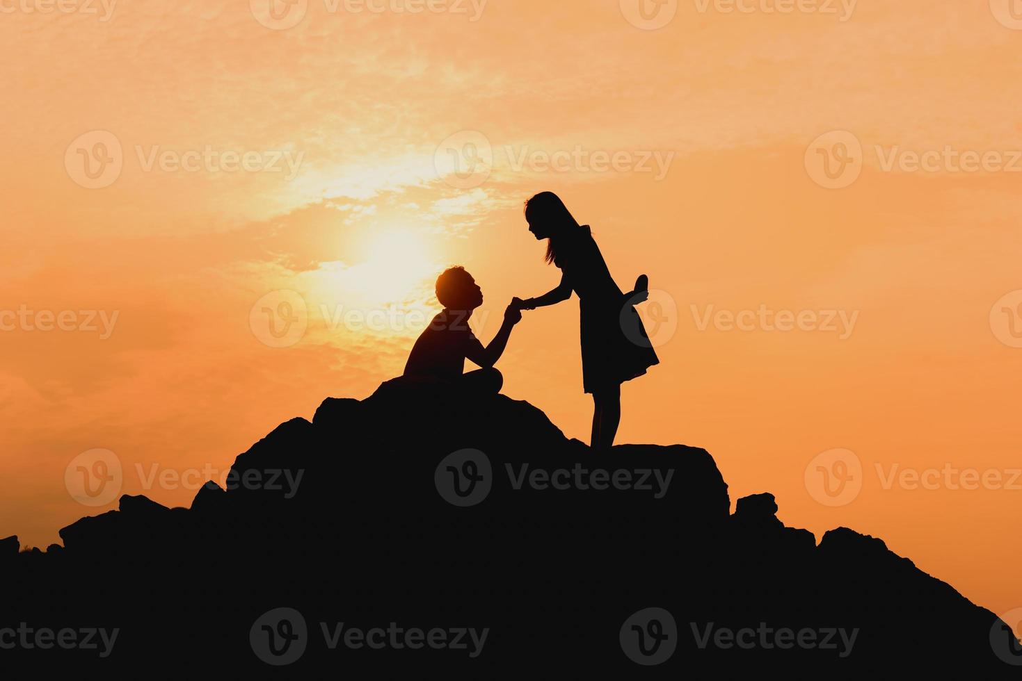 Happy young couple together against beautiful sunset. Freedom, photo