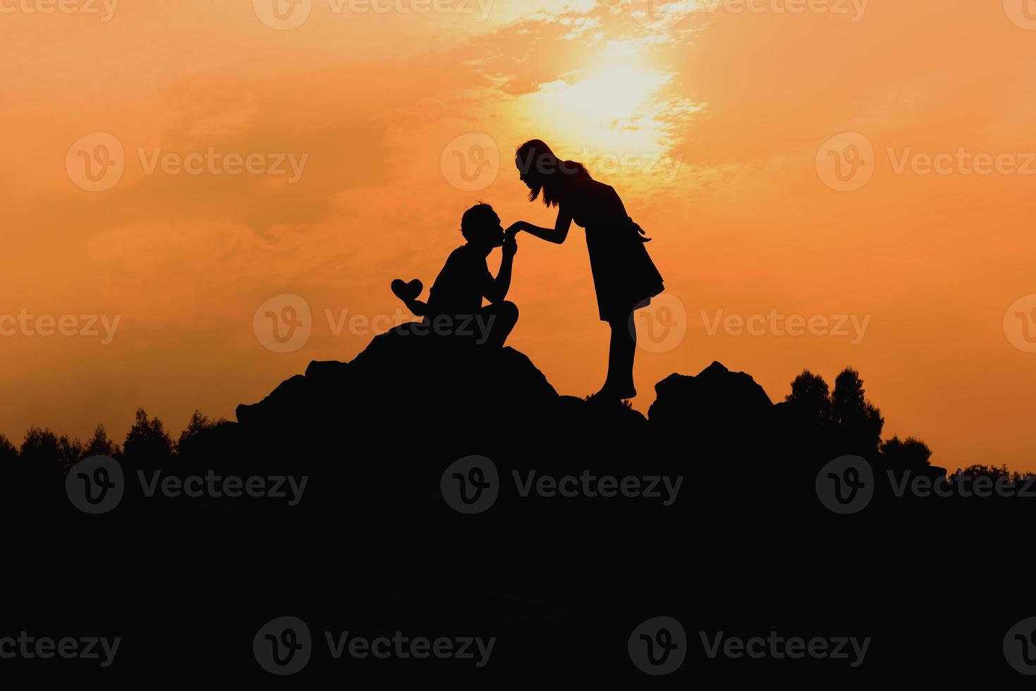 Happy young couple together against beautiful sunset. Freedom, photo