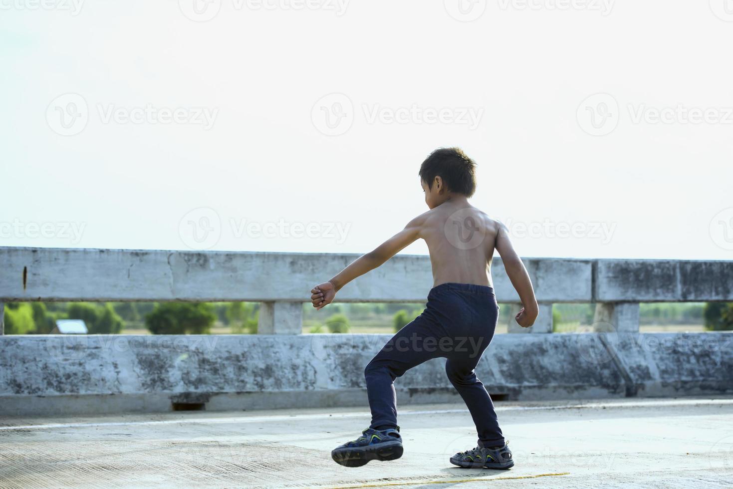 Healthy and happy kids doing leg strengthening and flexibility exercises. photo