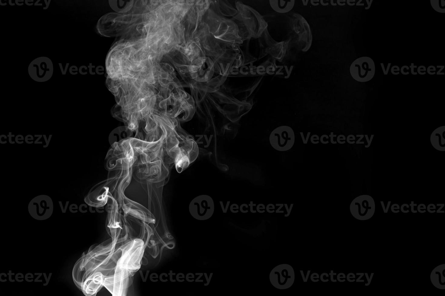 Abstract white smoke animated on a black background photo