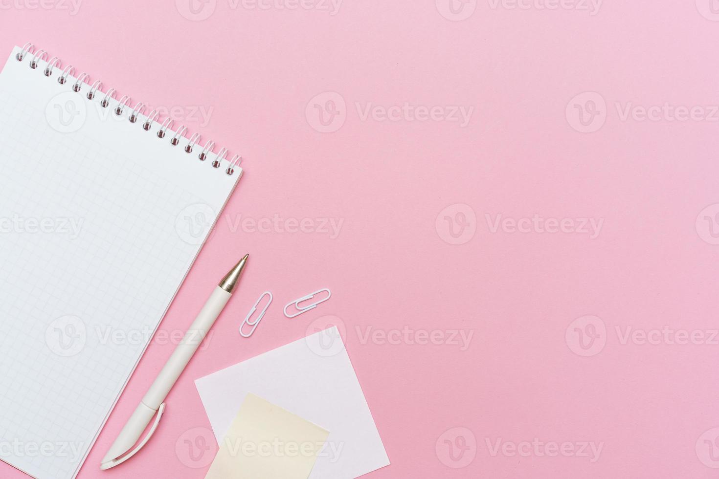 Workspace concept for school or office. Flat lay with an open notebook photo