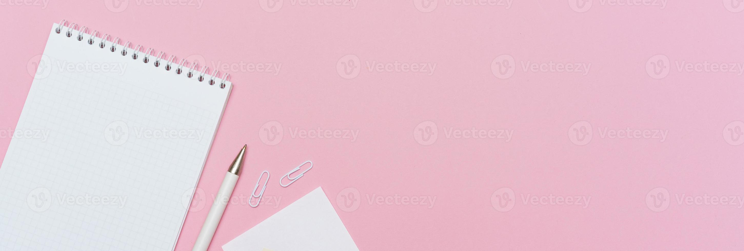 Workspace concept for school or office. Flat lay with an open notebook photo