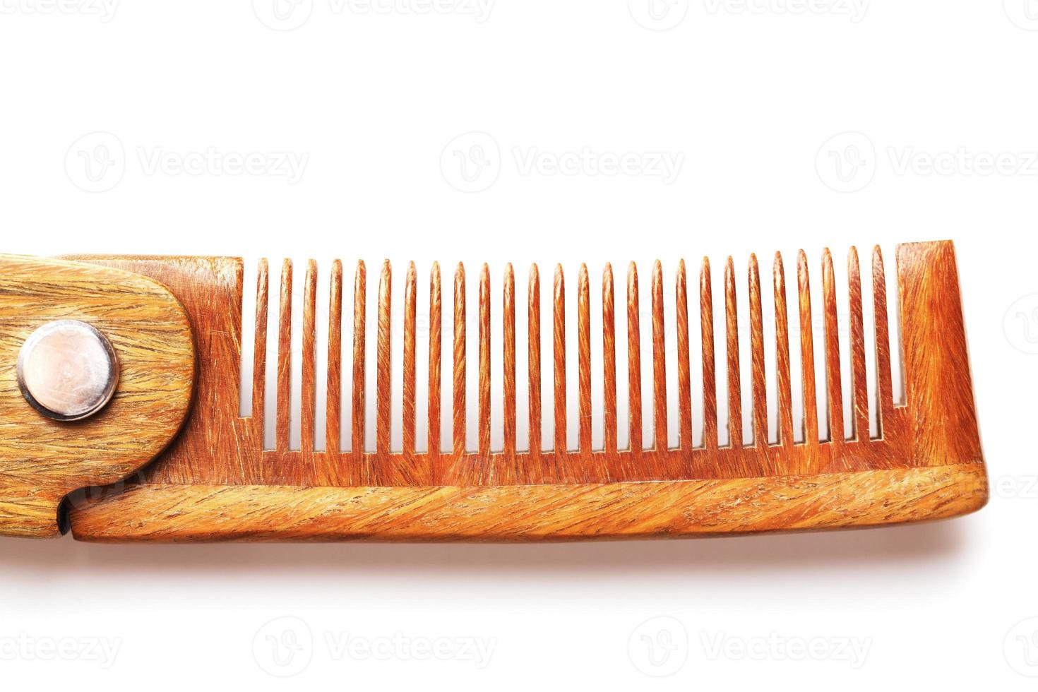 Wooden comb made of natural sandalwood for men on a white background. photo
