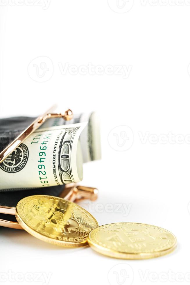 An open black wallet with money, dollars and bitcoin coins on a white background. photo