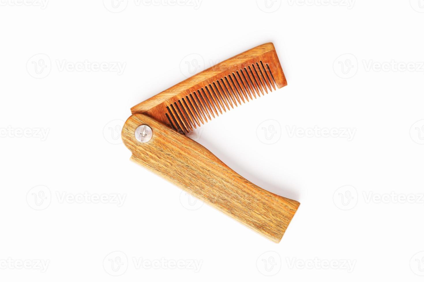 Wooden comb made of natural sandalwood for men on a white background. photo