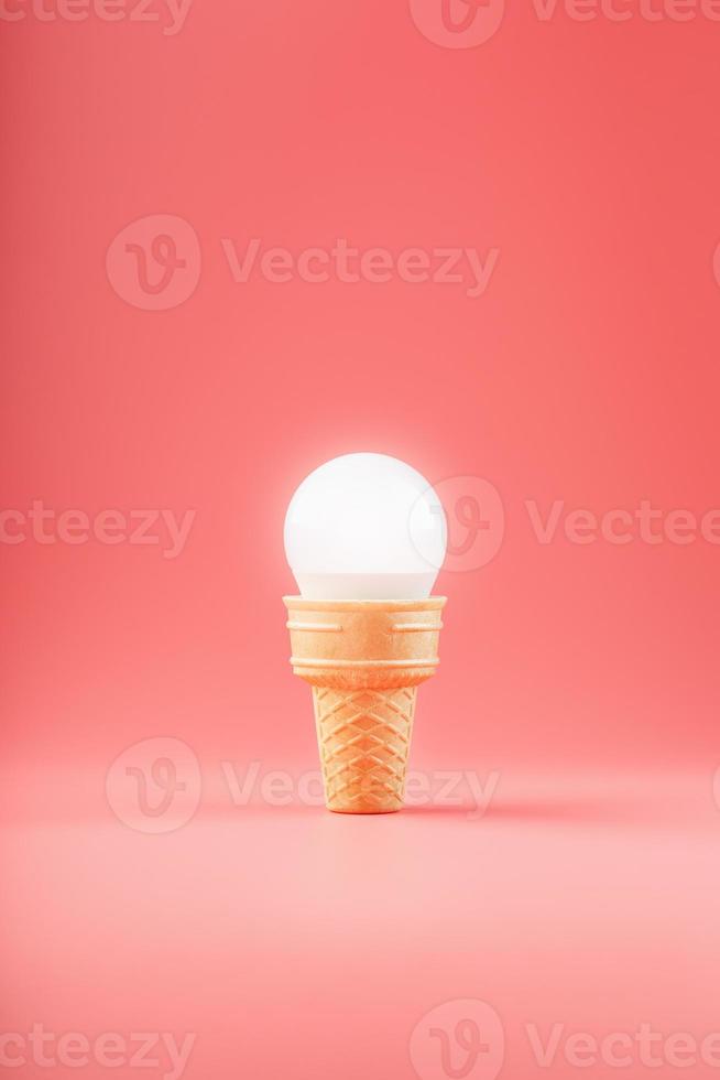 Light bulb ice cream in a waffle Cup on a pink background. photo
