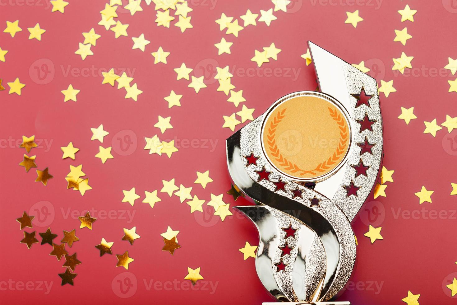 Golden Superprize with a scattering of stars on a red background. photo