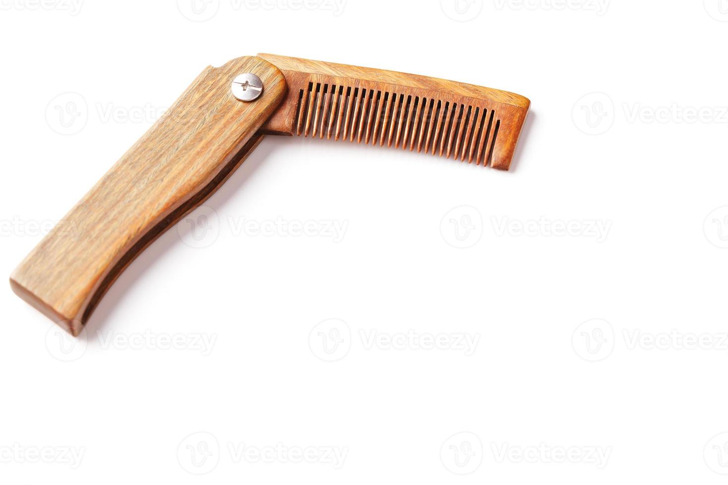 Sandalwood comb on a white background. Hair care. photo