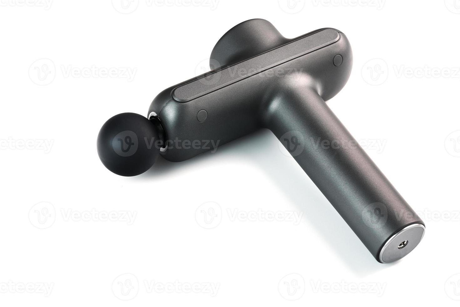 Manual electric body massager on a white background. photo