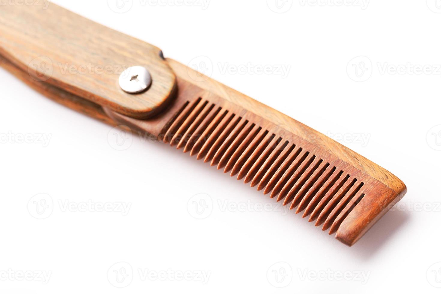 Wooden comb made of natural sandalwood for men on a white background. photo