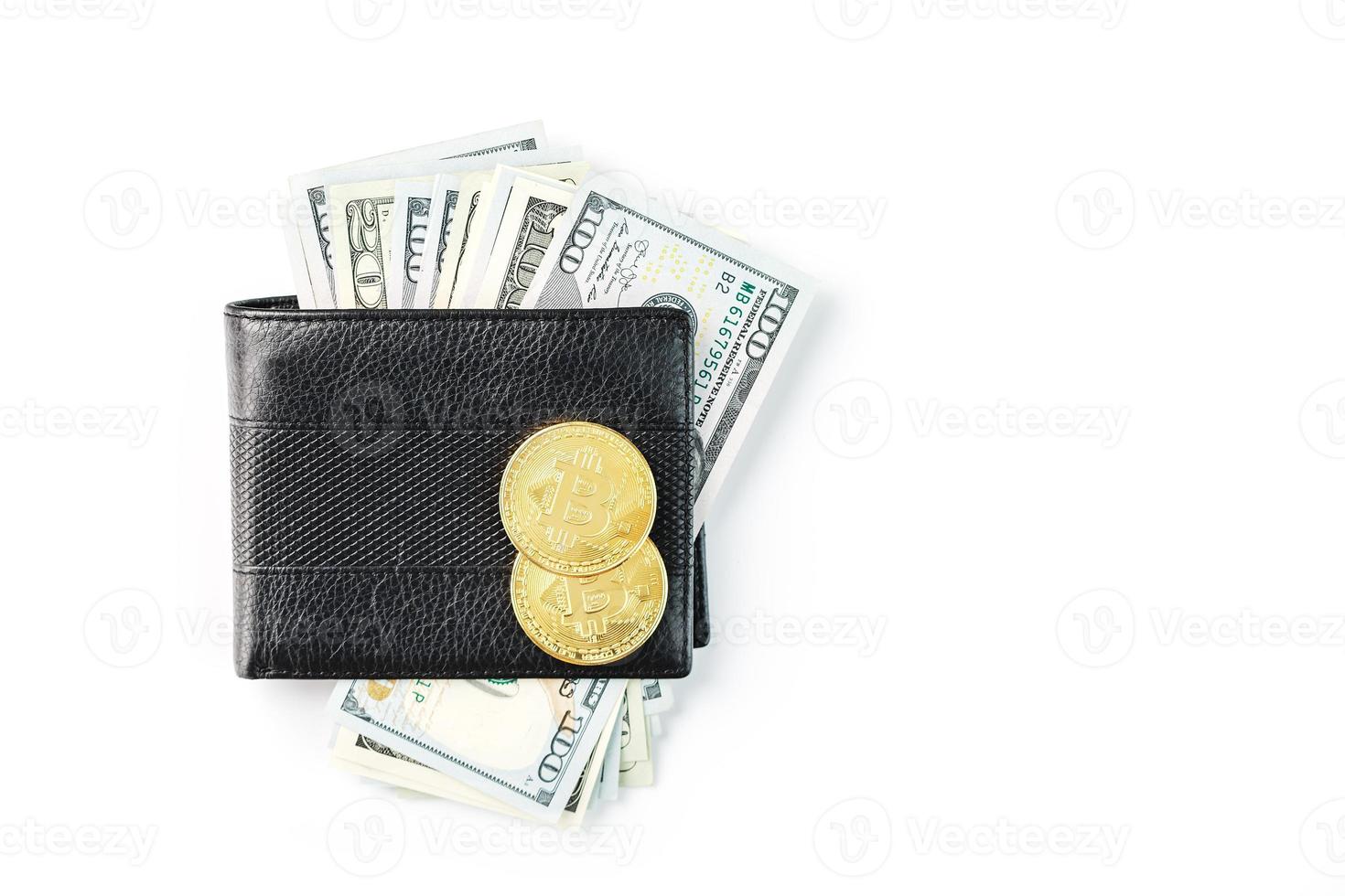 A black wallet with dollars and bitcoins on an isolated white background. Symbol of prosperity and prosperity. photo