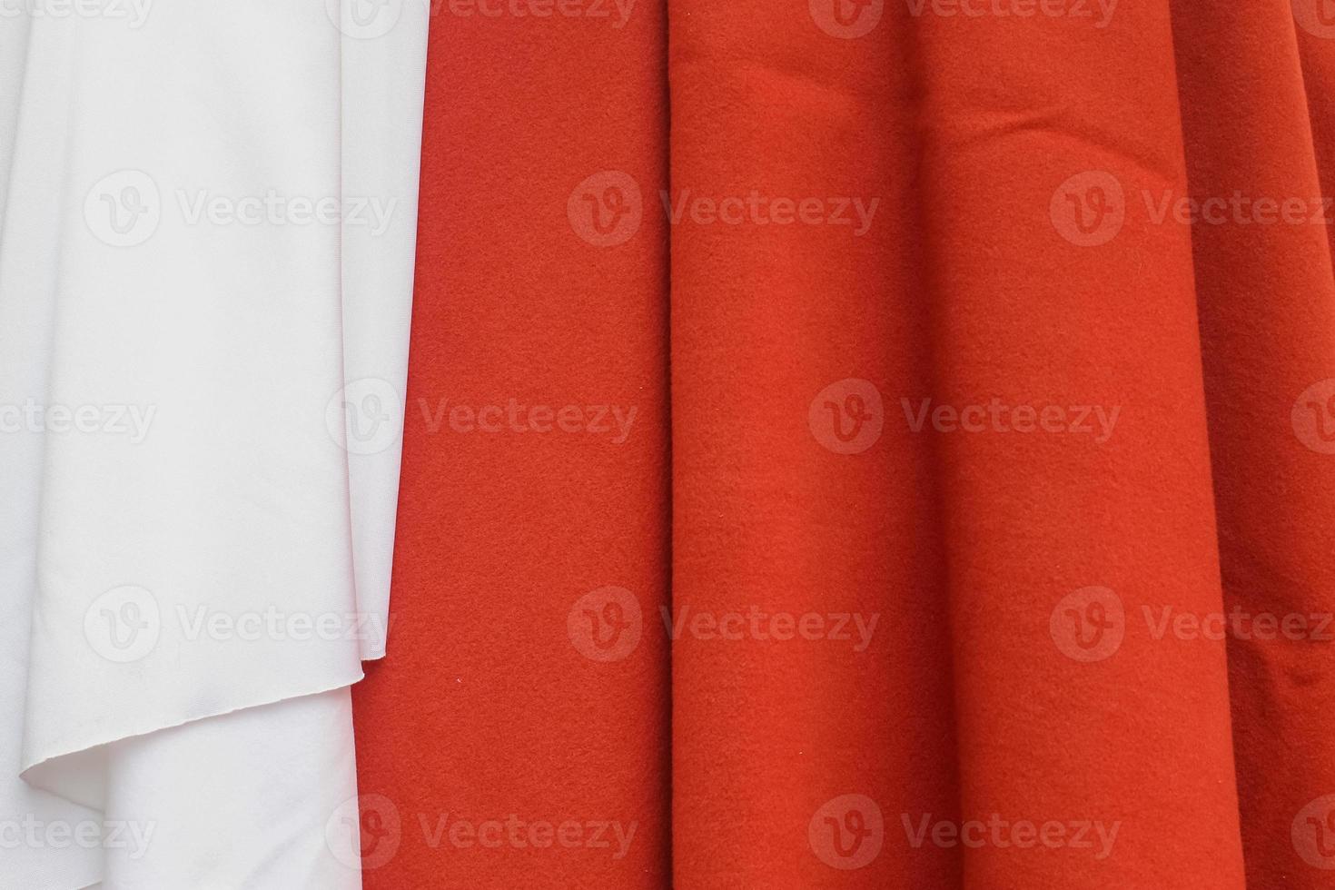 Samples of cloth and fabrics in different colors found at a fabrics market photo