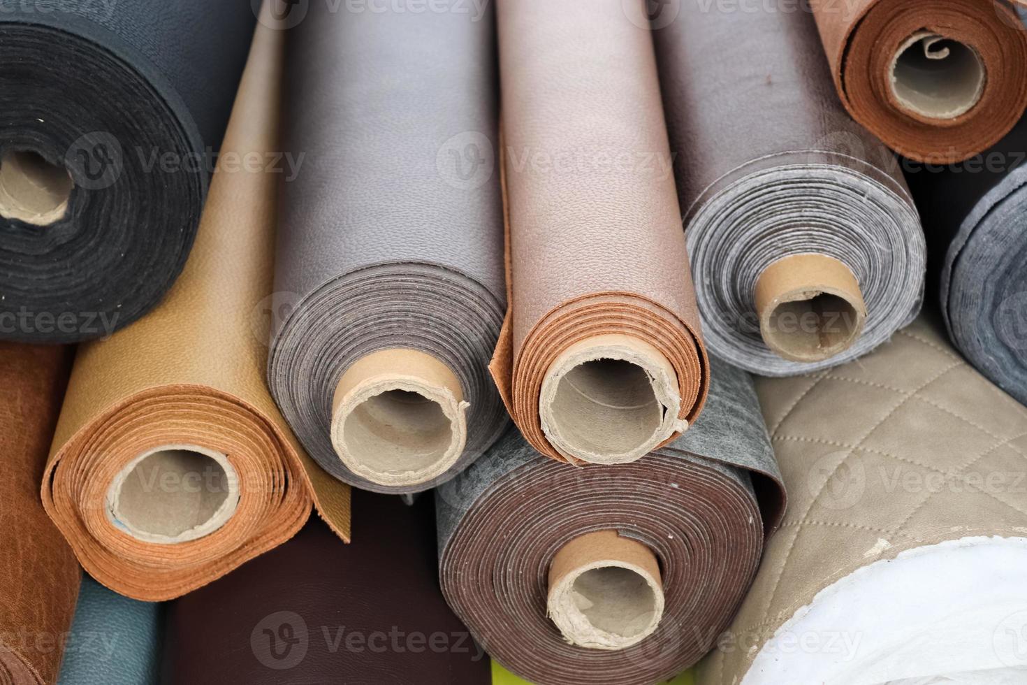 Samples of cloth and fabrics in different colors found at a fabrics market photo