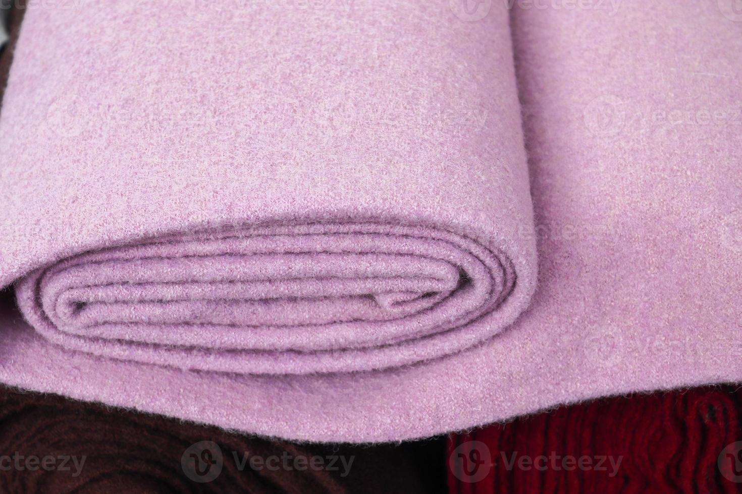 Samples of cloth and fabrics in different colors found at a fabrics market photo