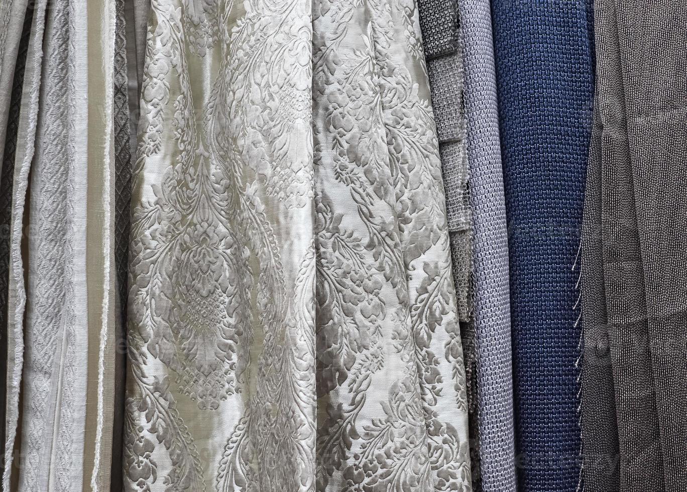 Samples of cloth and fabrics in different colors found at a fabrics market photo
