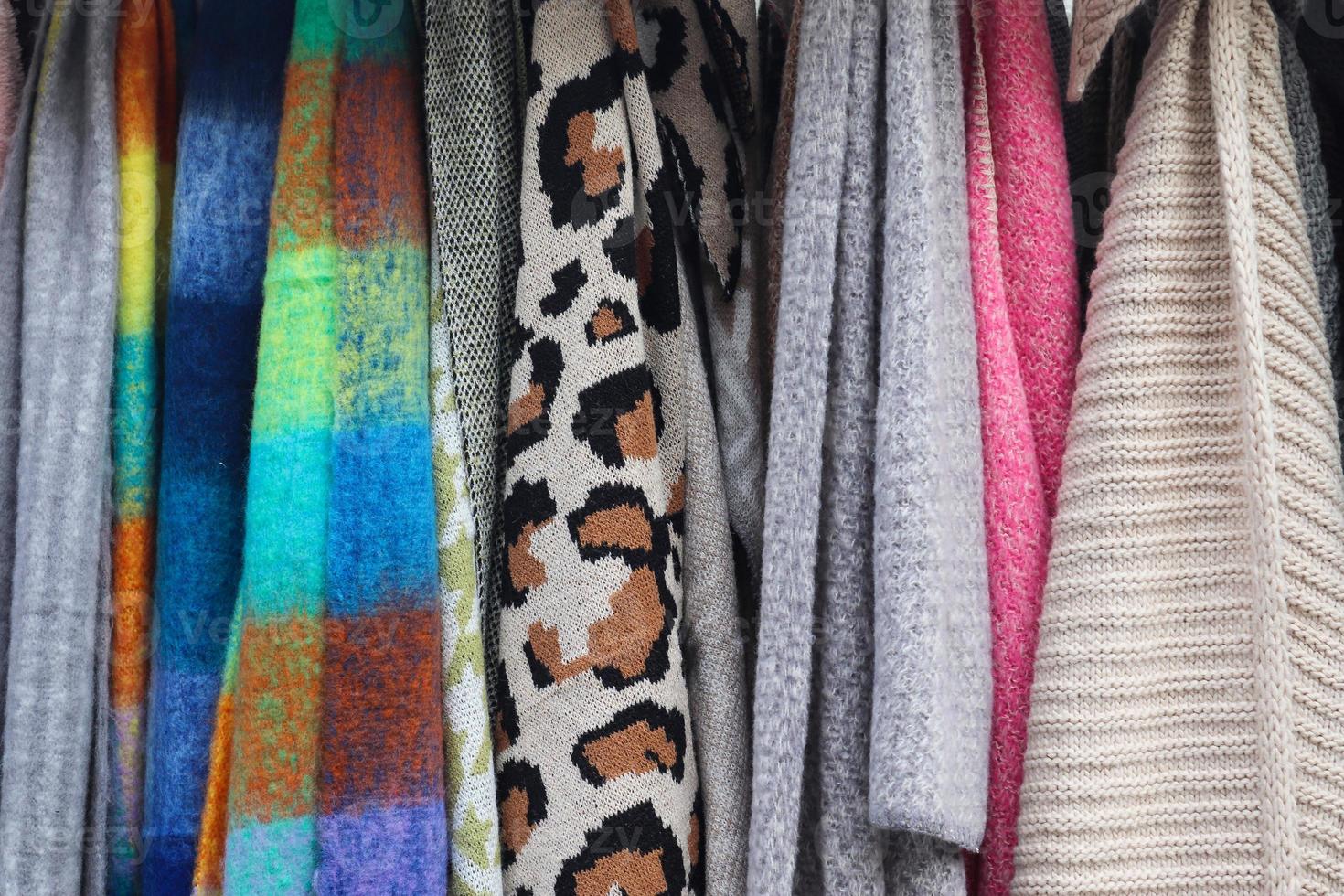Samples of cloth and fabrics in different colors found at a fabrics market photo