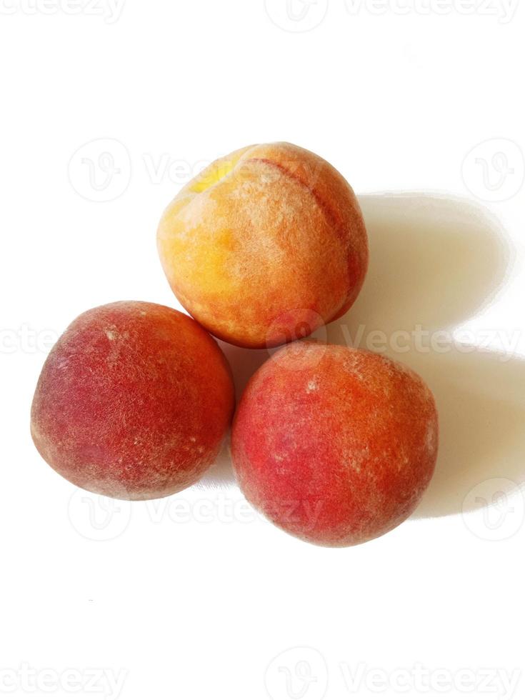 juicy ripe peaches on white background photo