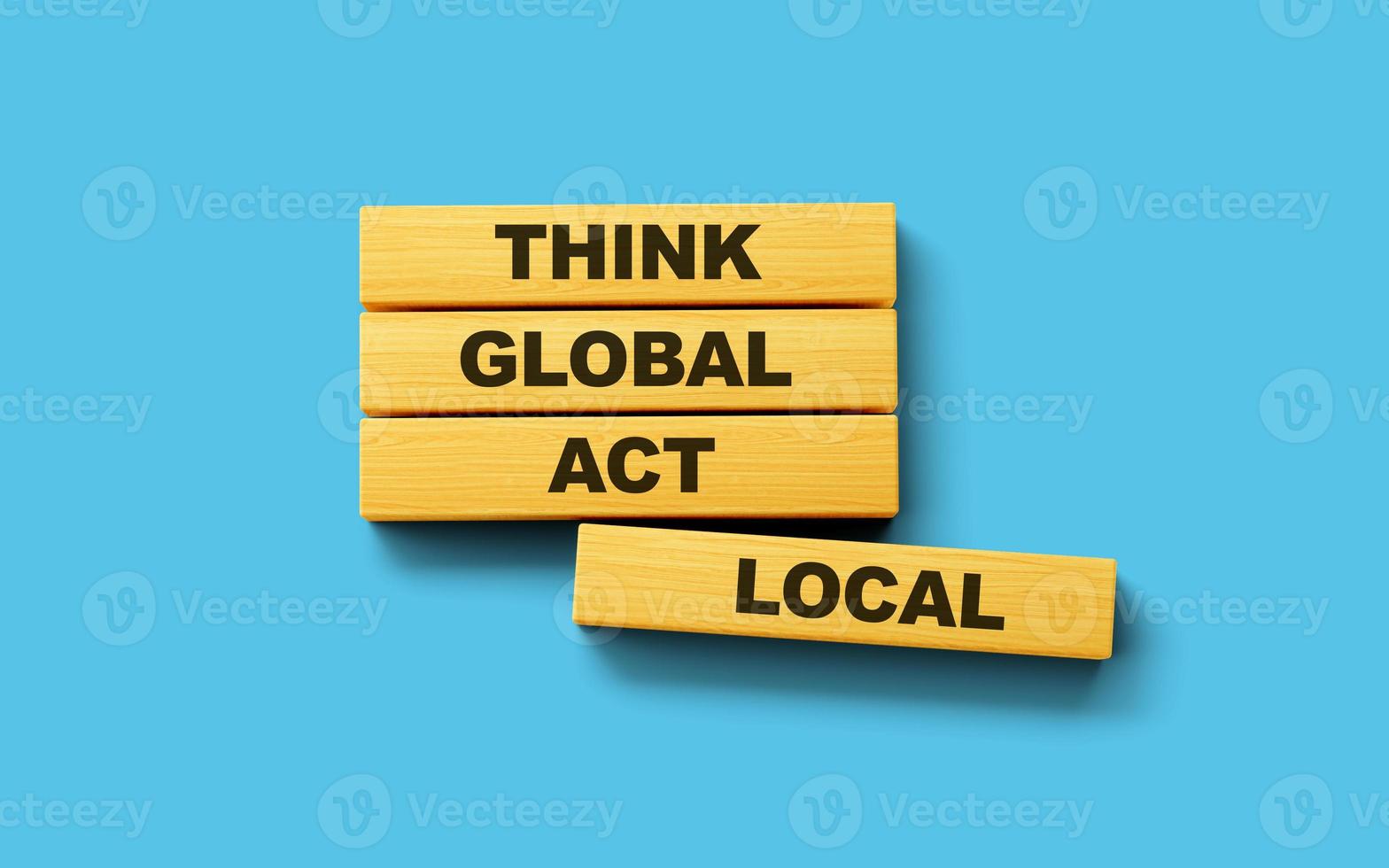Think global act local symbol. Wooden blocks form the words on Blue background 3d illustration photo
