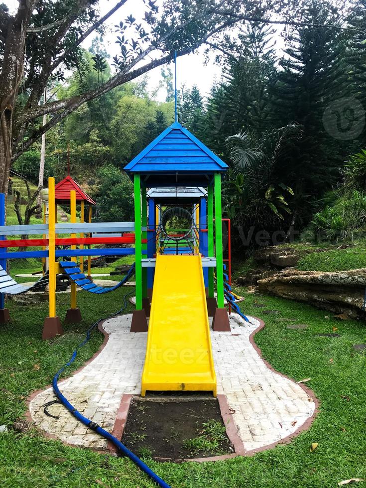 Modern Playground Equipment. Modern Colorful kids playground on yard in the park photo