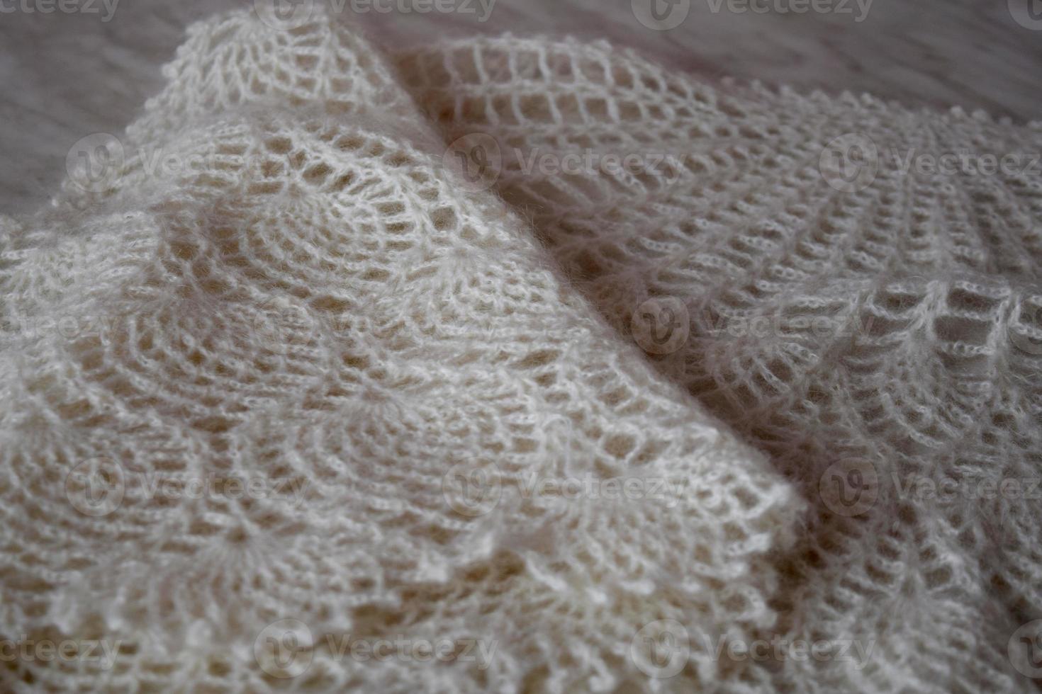 White knitted shawl close-up. Orenburg downy shawl photo