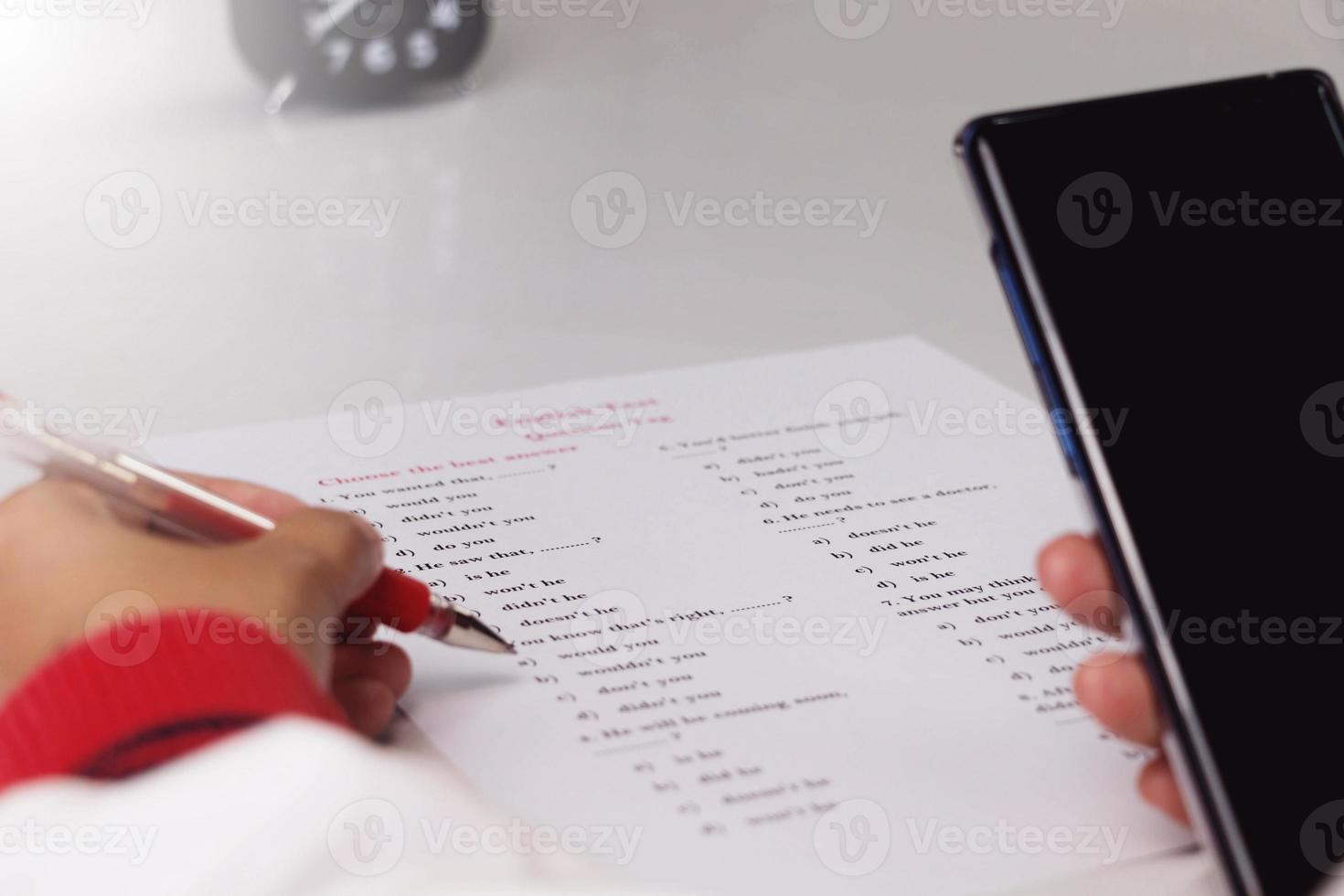 hand working on English test photo