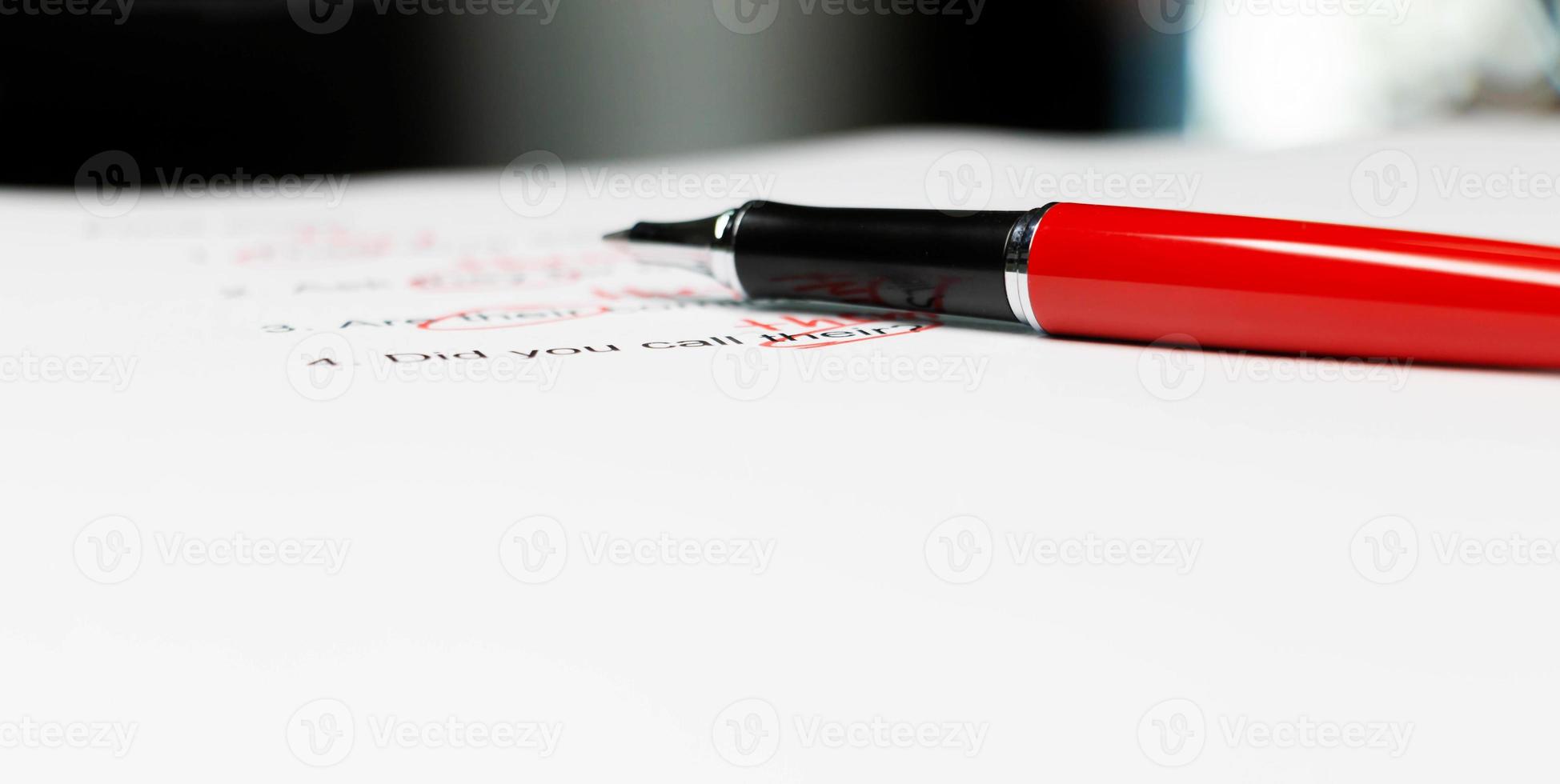 proofreading paper on table photo