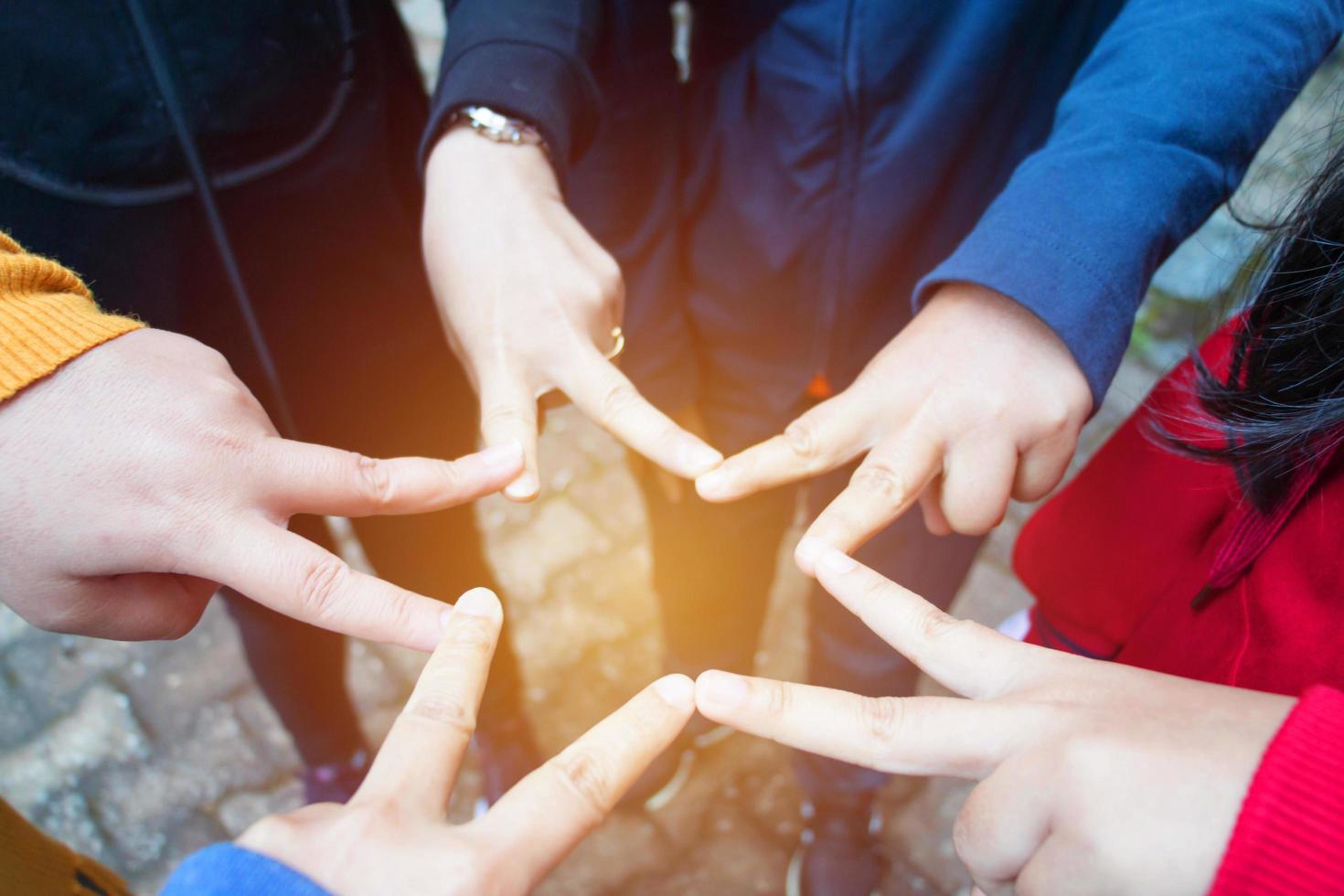 females hands together making star for unity photo