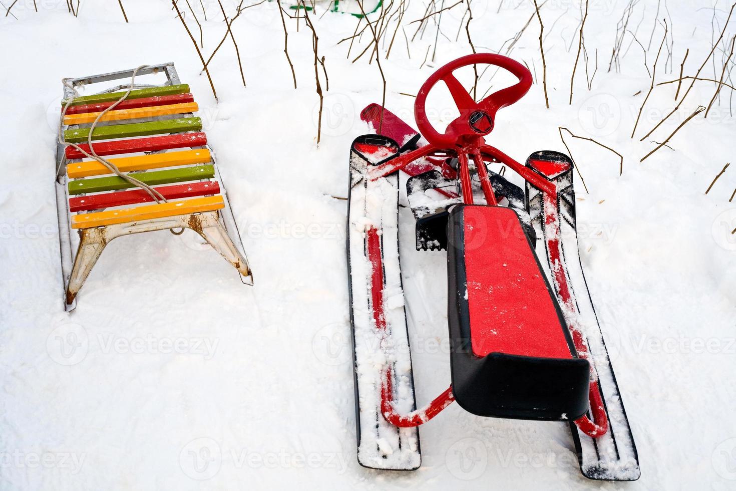 old sledge and new snow scooter photo