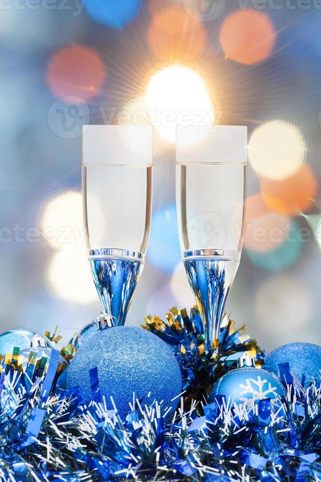 glasses, blue Xmass balls on blurry background 2 photo