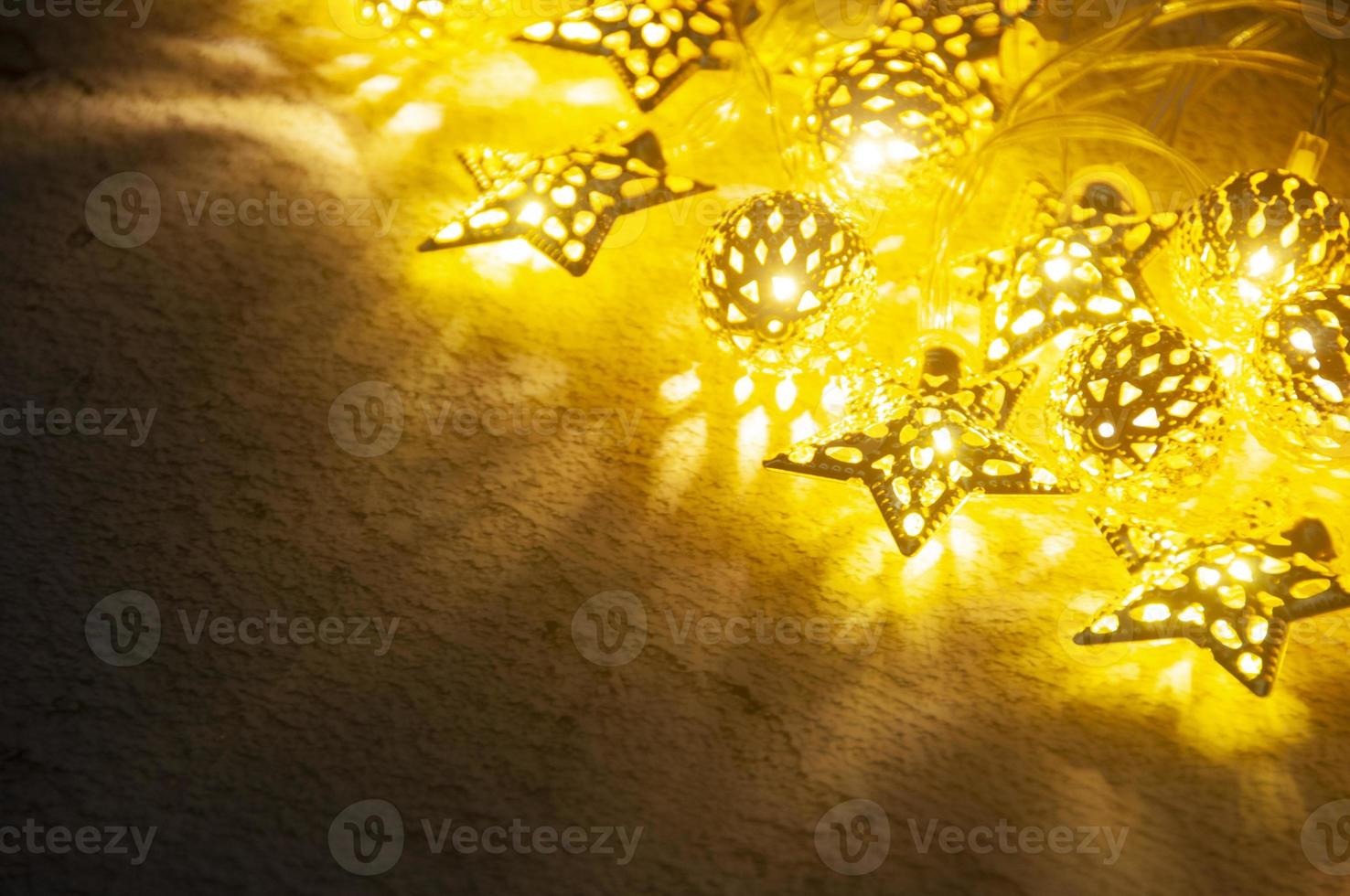 Shining Christmas golden ball and stars with customizable space for text. Copy space. photo