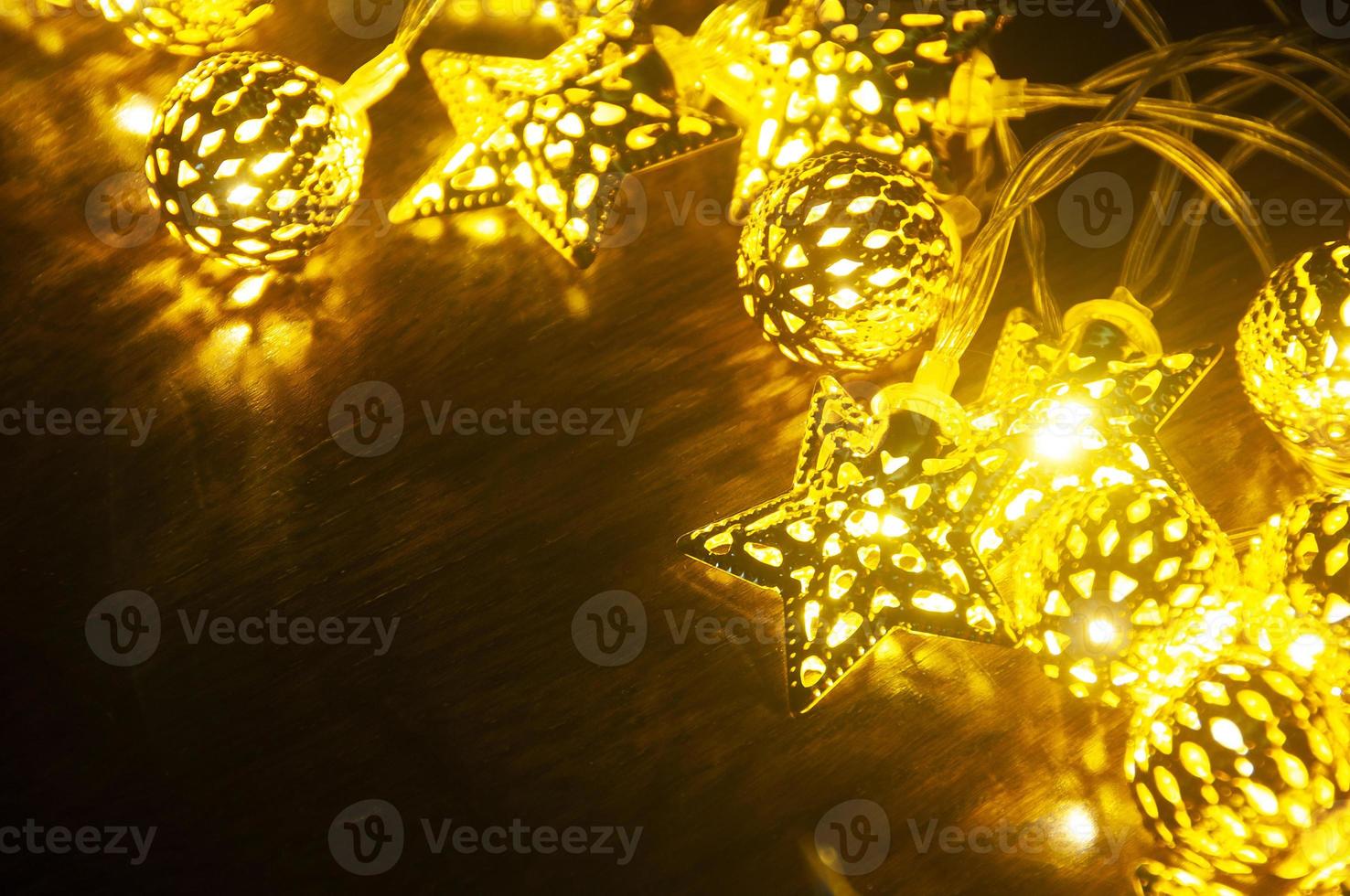 Shining Christmas golden balls and stars with customizable space for text. Copy space. photo