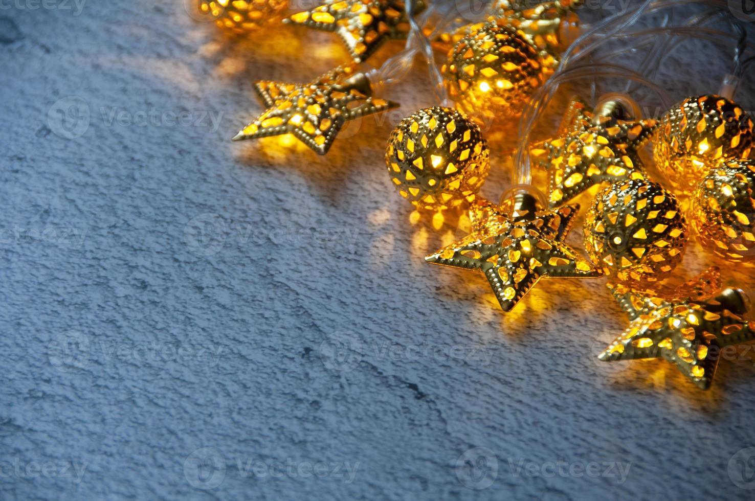 Christmas golden balls and stars on marble background with customizable space for text. Copy space. photo