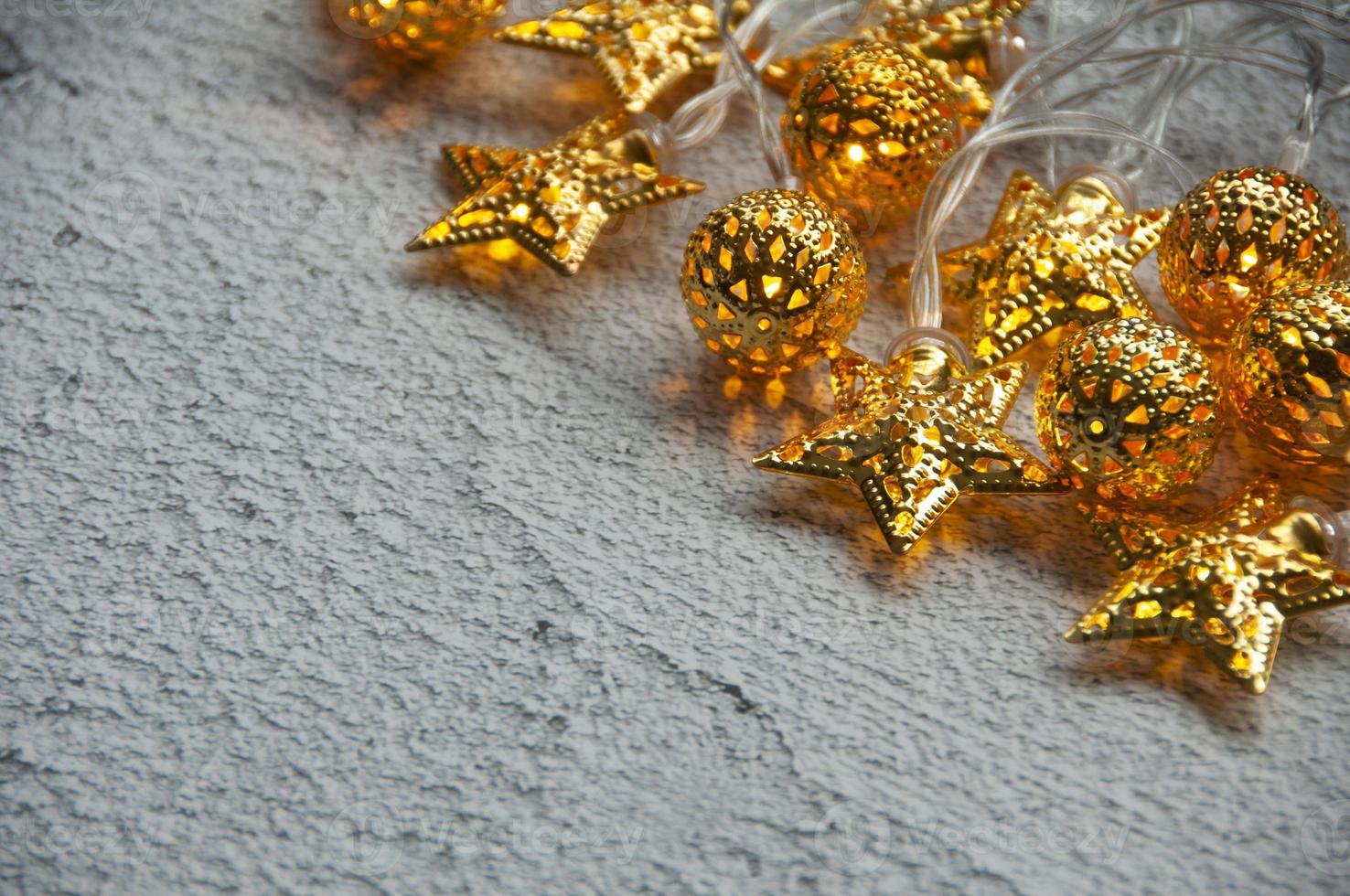 Christmas golden balls and stars on marble background with customizable space for text. Copy space. photo