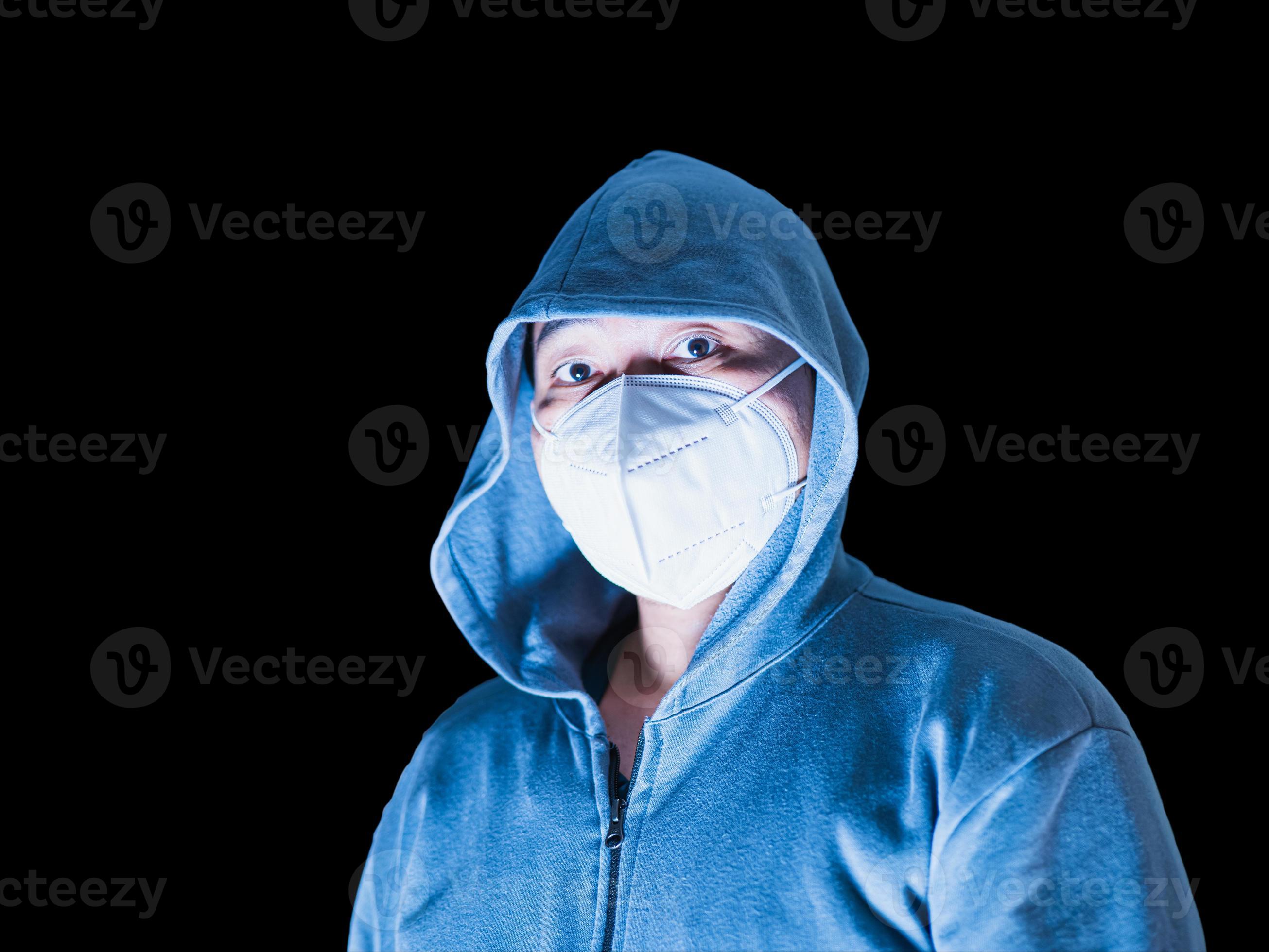 Premium Photo  A man in sunglasses wearing a hoodie with a medical mask on  his face.