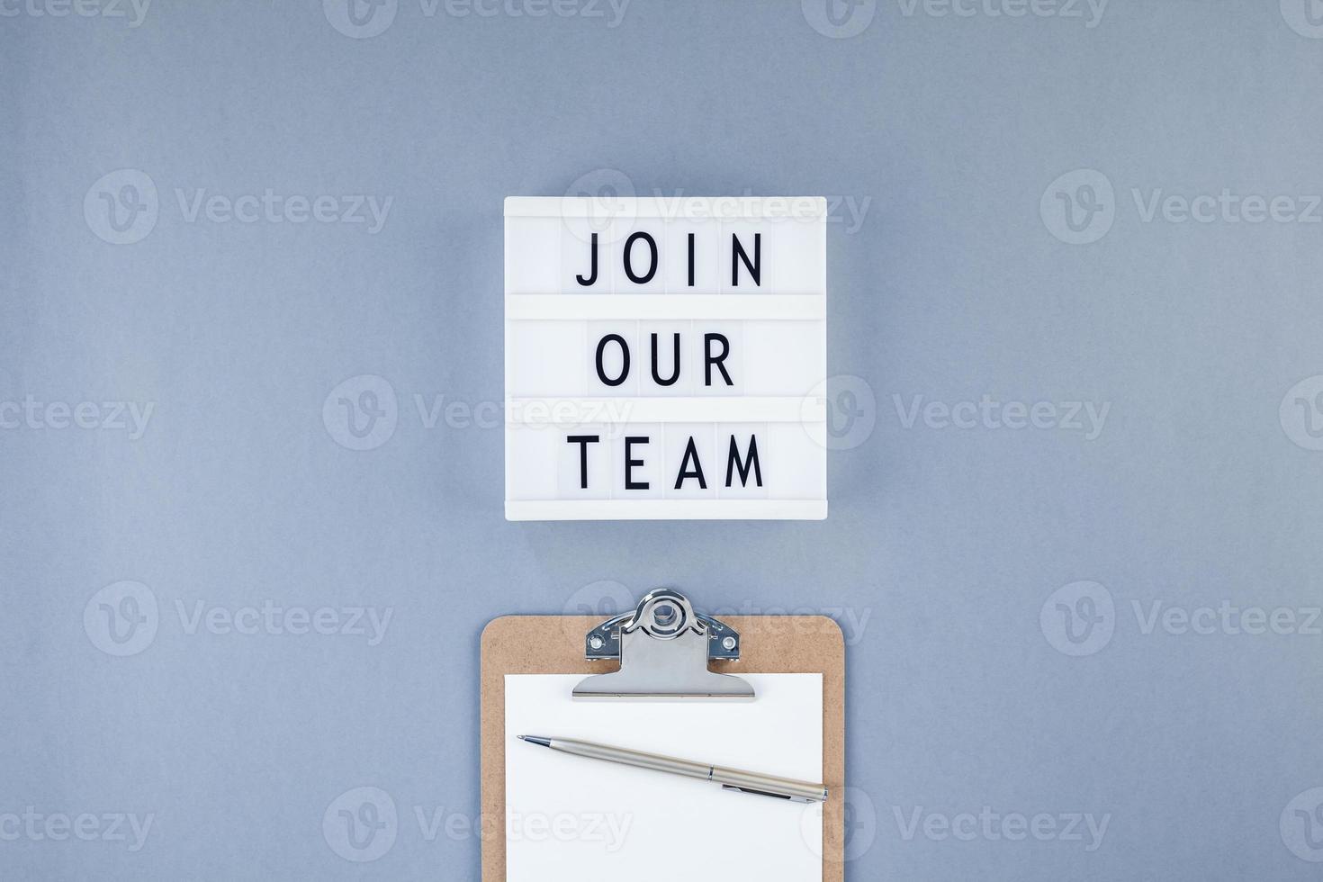 Join our team flat lay on blue background photo