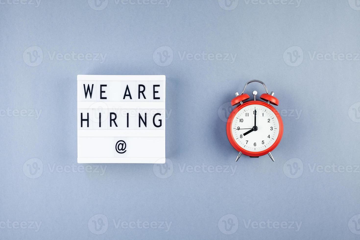 We are hiring flat lay on blue background photo