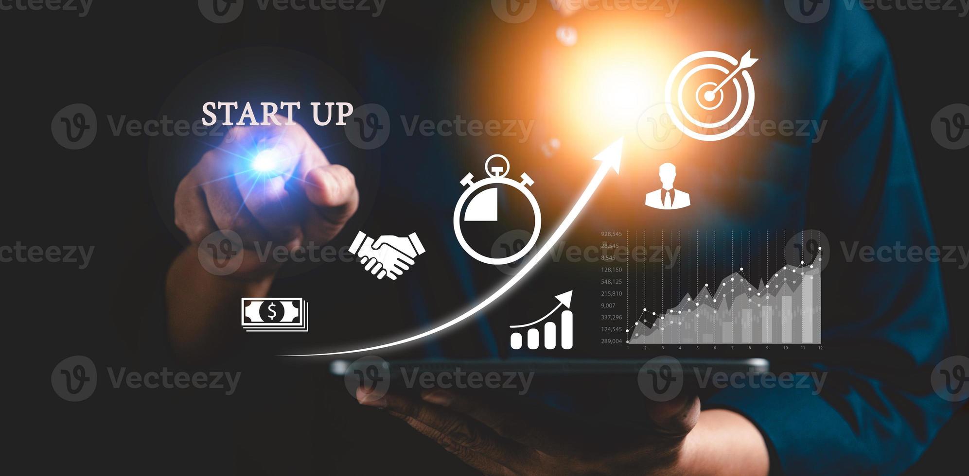 Startup concept with icon business and network connection on modern virtual interface from digital tablet. People hand touching on tablet. Developing and improving organization with modern technology. photo