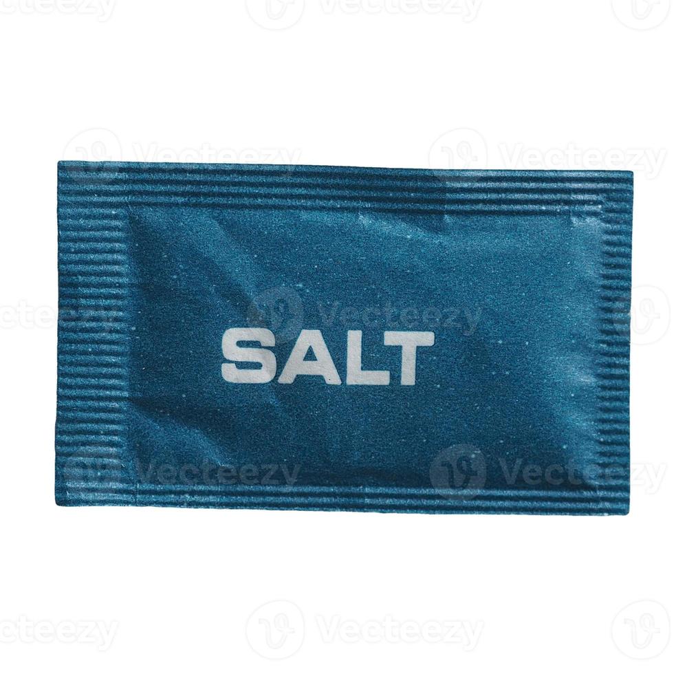 single dose salt sachet isolated over white photo