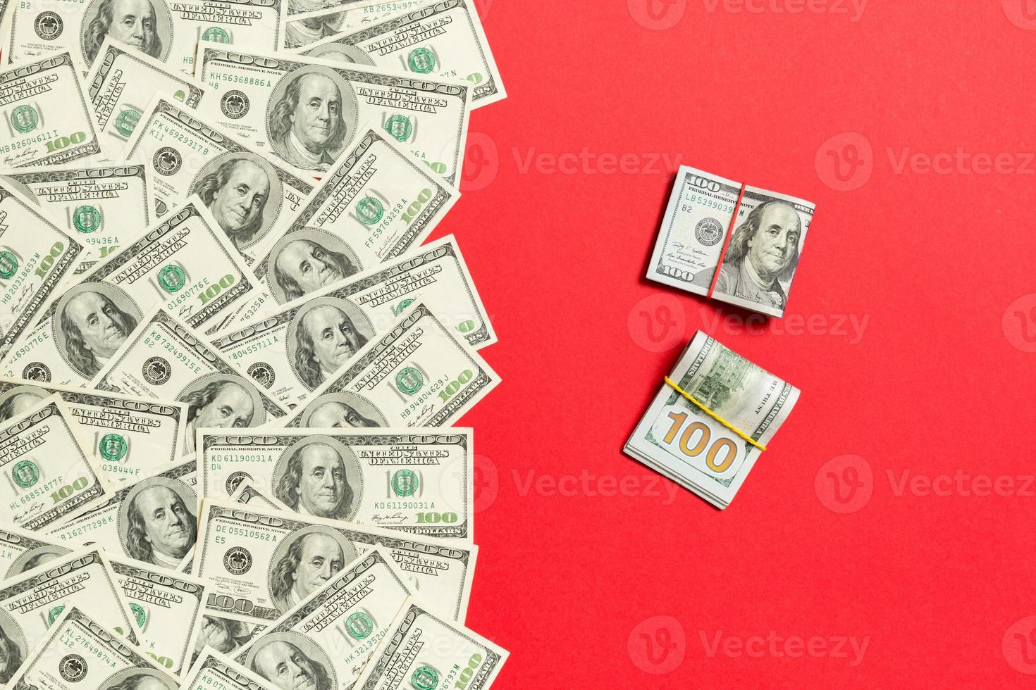 Heap of hundred Dollar Bills on colored background top view, with empty place for your text business money concept photo