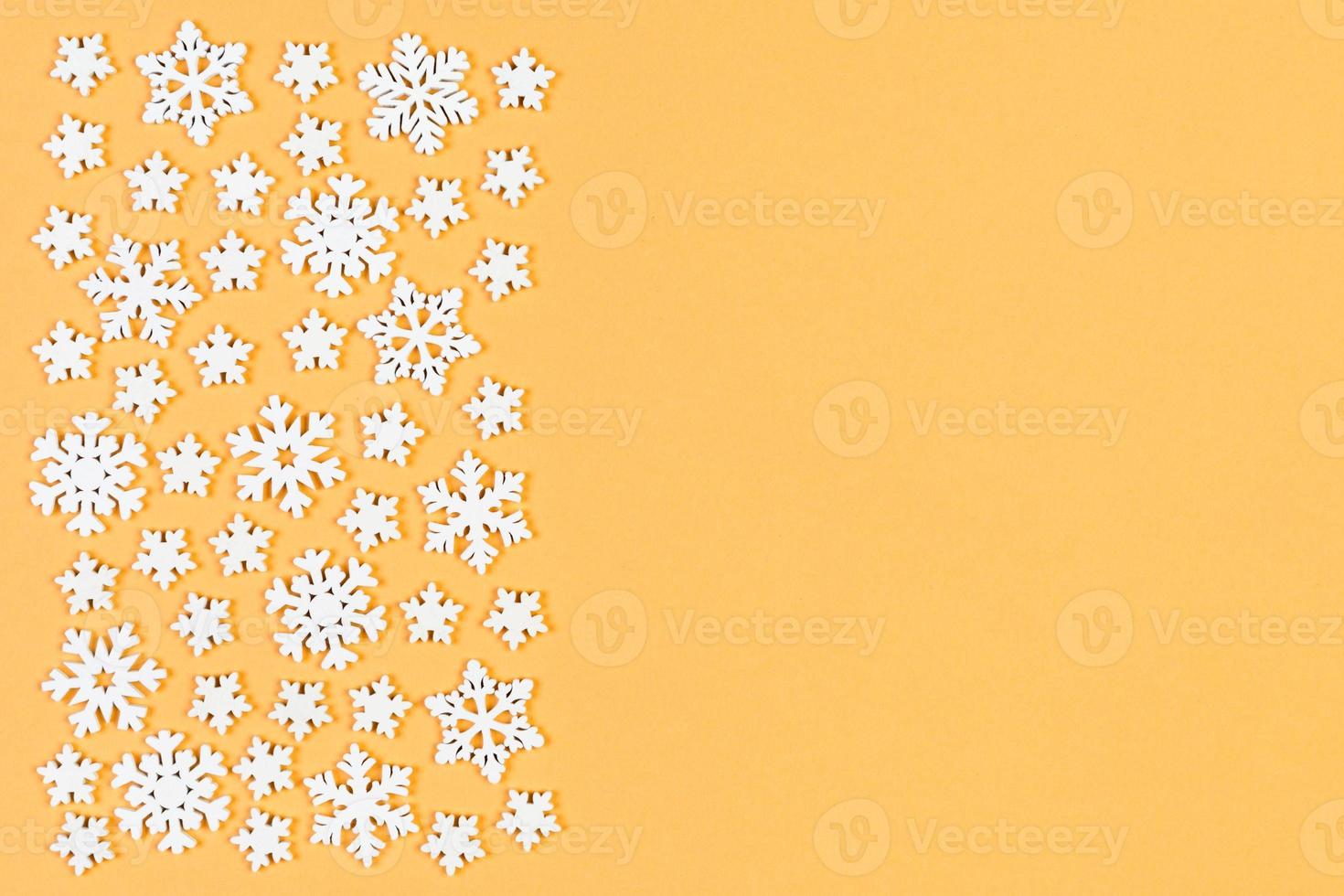 Top view of winter ornament made of white snowflakes on colorful background. Happy New Year concept with copy space photo