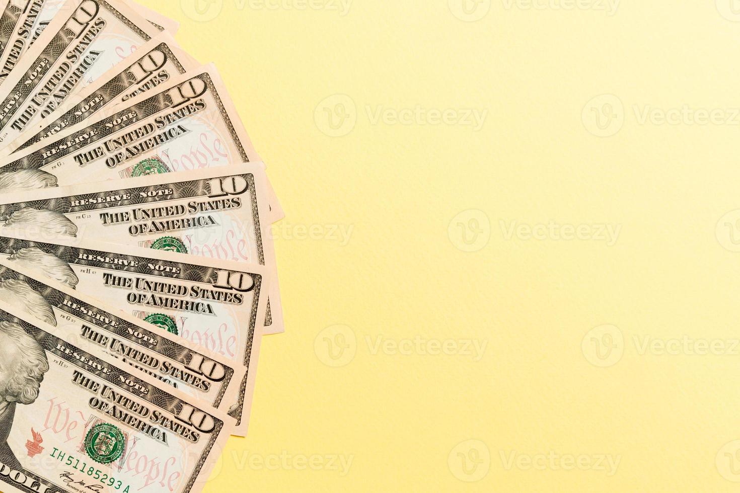 A Hundred dollar currency fan close up, Top view of business concept on colored background with copy space photo