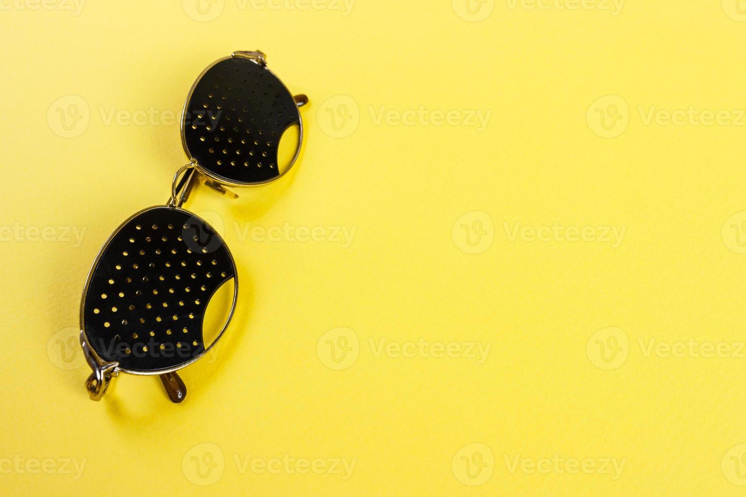 Pinhole glasses on an children eye chart photo