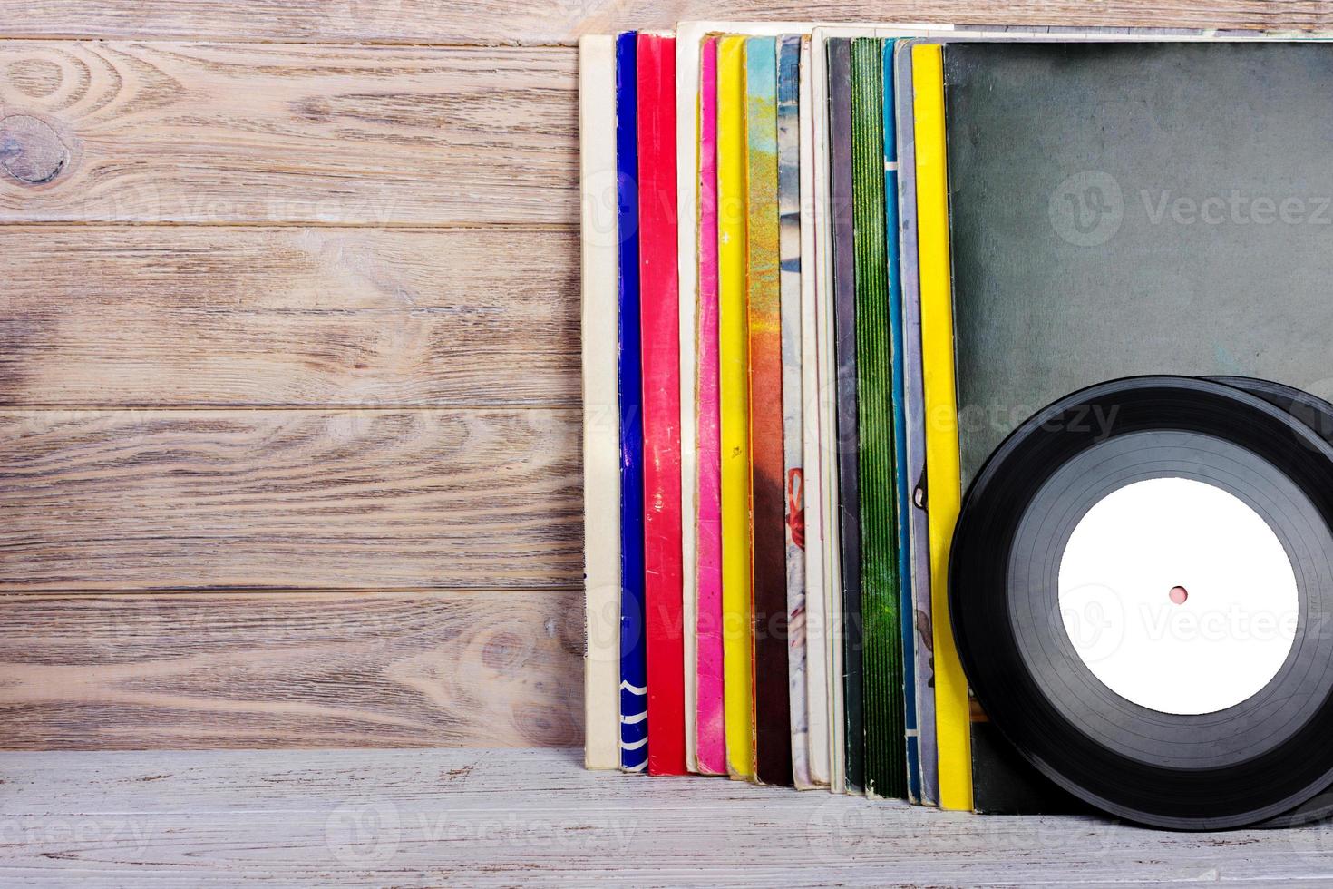 Vinyl records and headphones on table. Vintage vinyl disk photo