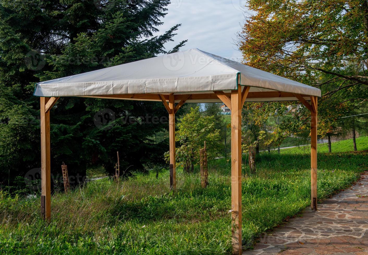 Wooden gazebo with cover photo